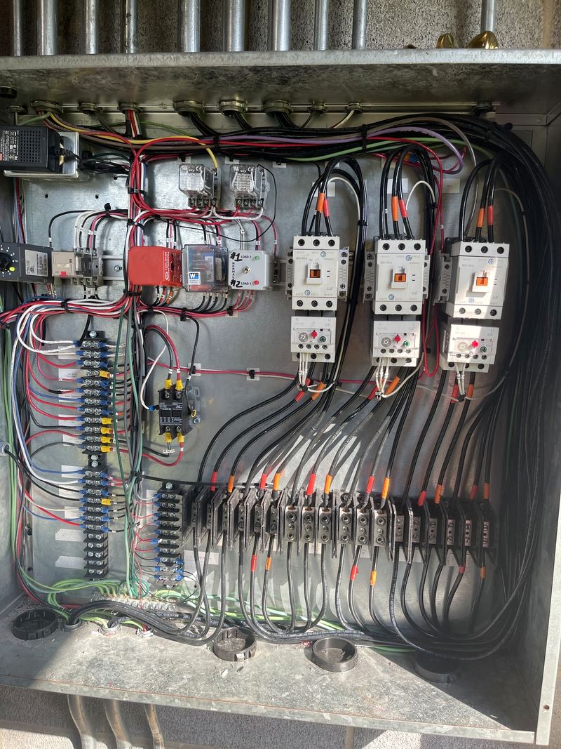 Power distribution panel with contactors and power wiring